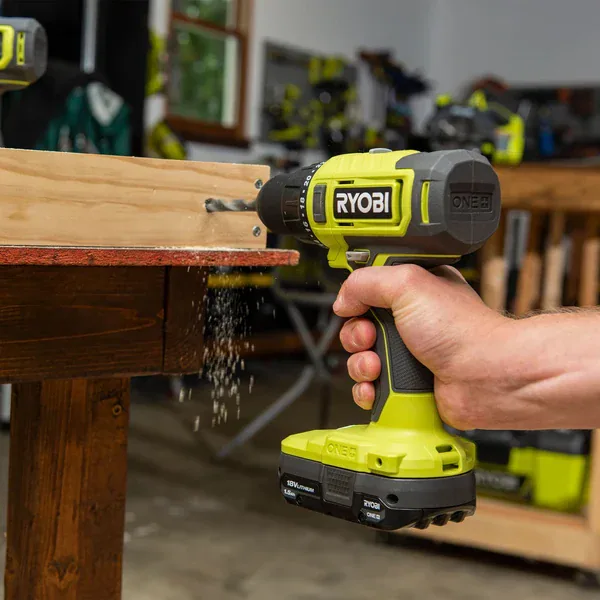 Drill boring into wood
